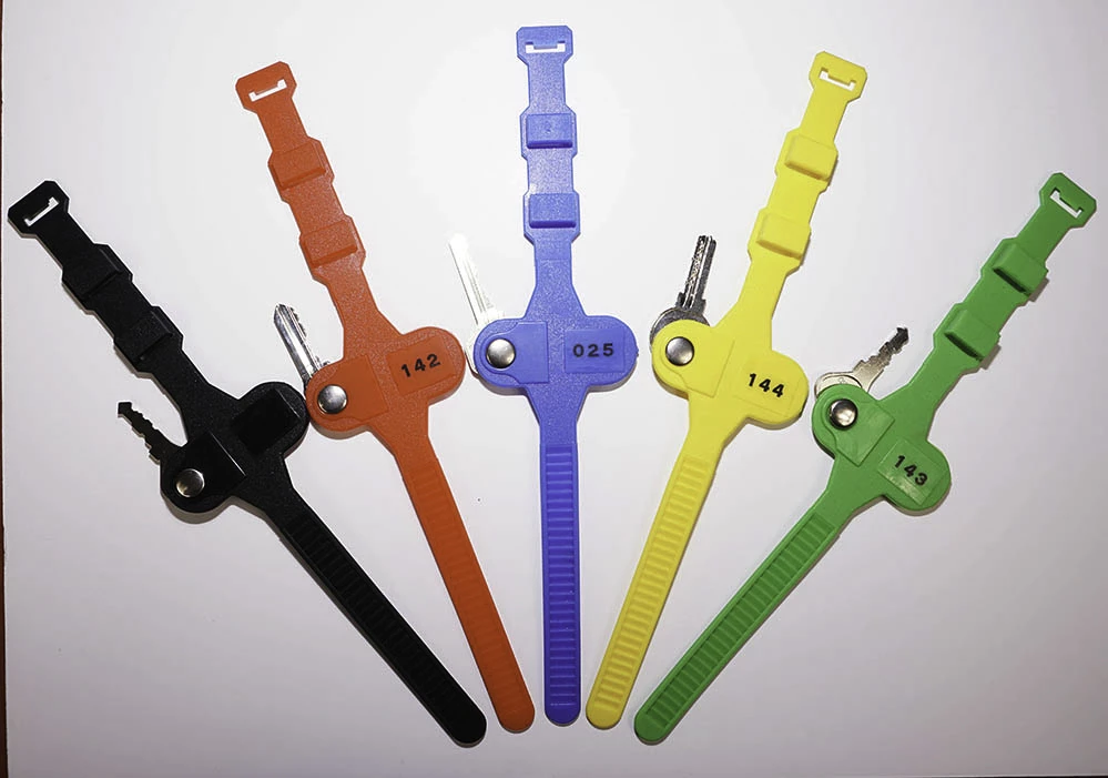 Colourful numbered wrist straps attached to locker keys in sports centre Numbered wrist straps provide secure, comfortable key carrying whilst enabling quick locker identification
