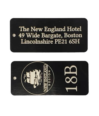 Engraved laminate hotel key fobs with room numbers and logo