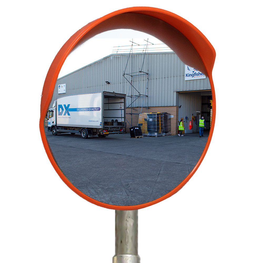 Weather resistant outdoor safety mirror at an industrial loading bay