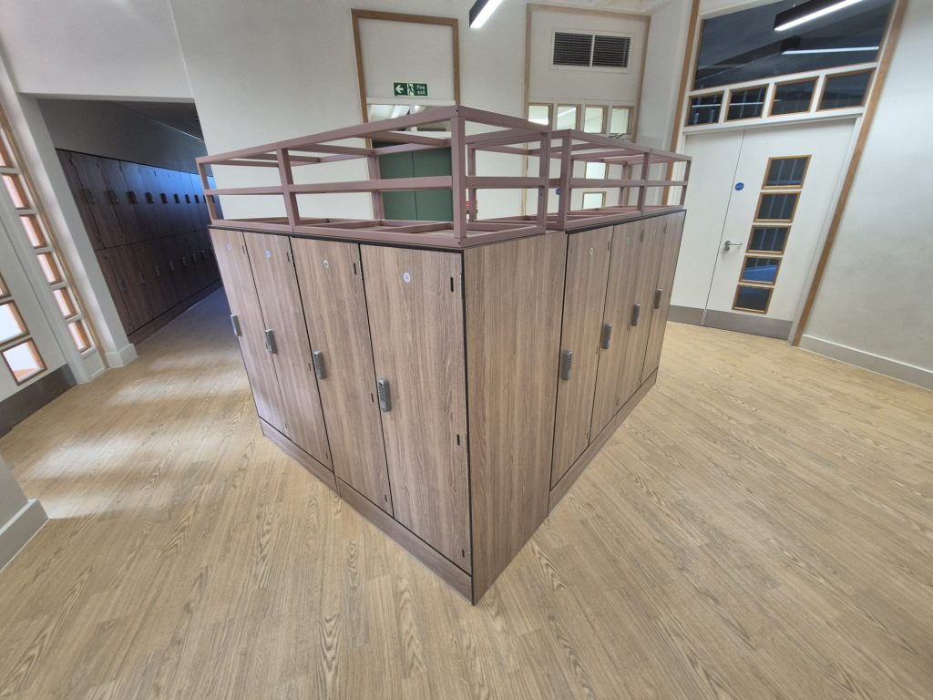 Laminate lockers installed in a modern office locker room big enough for a golf bag, size 450mm wide 450mm deep, minimum 1200mm high