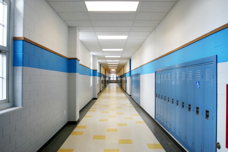steel school lockers installed along corridor wall