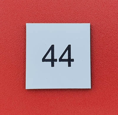 Number plates fixed by high strengthen double sided tape